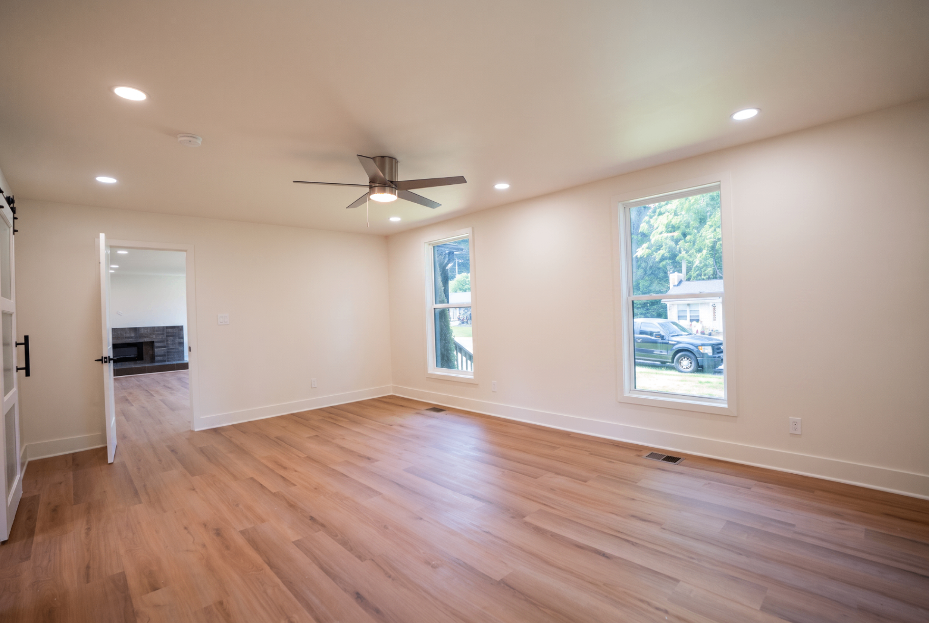 Primary bedroom bathed in natural light